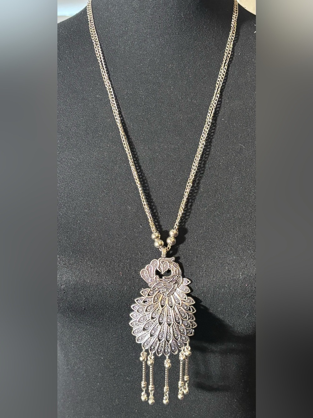 Intricate Silver-Tone Peacock Pendant Necklace with Dangling Bead Detail